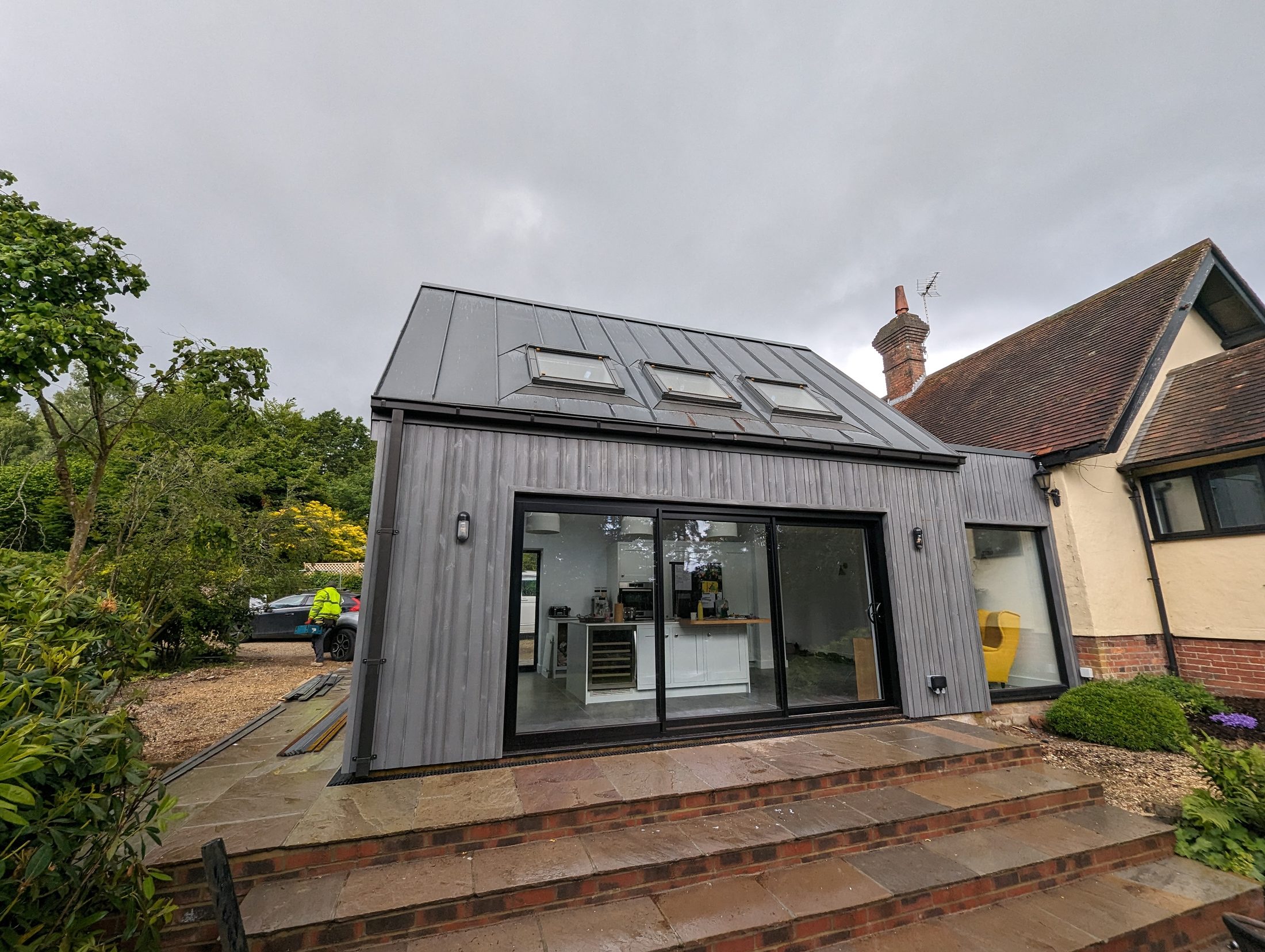 Completed Copperclad zinc standing-seam roof and extension