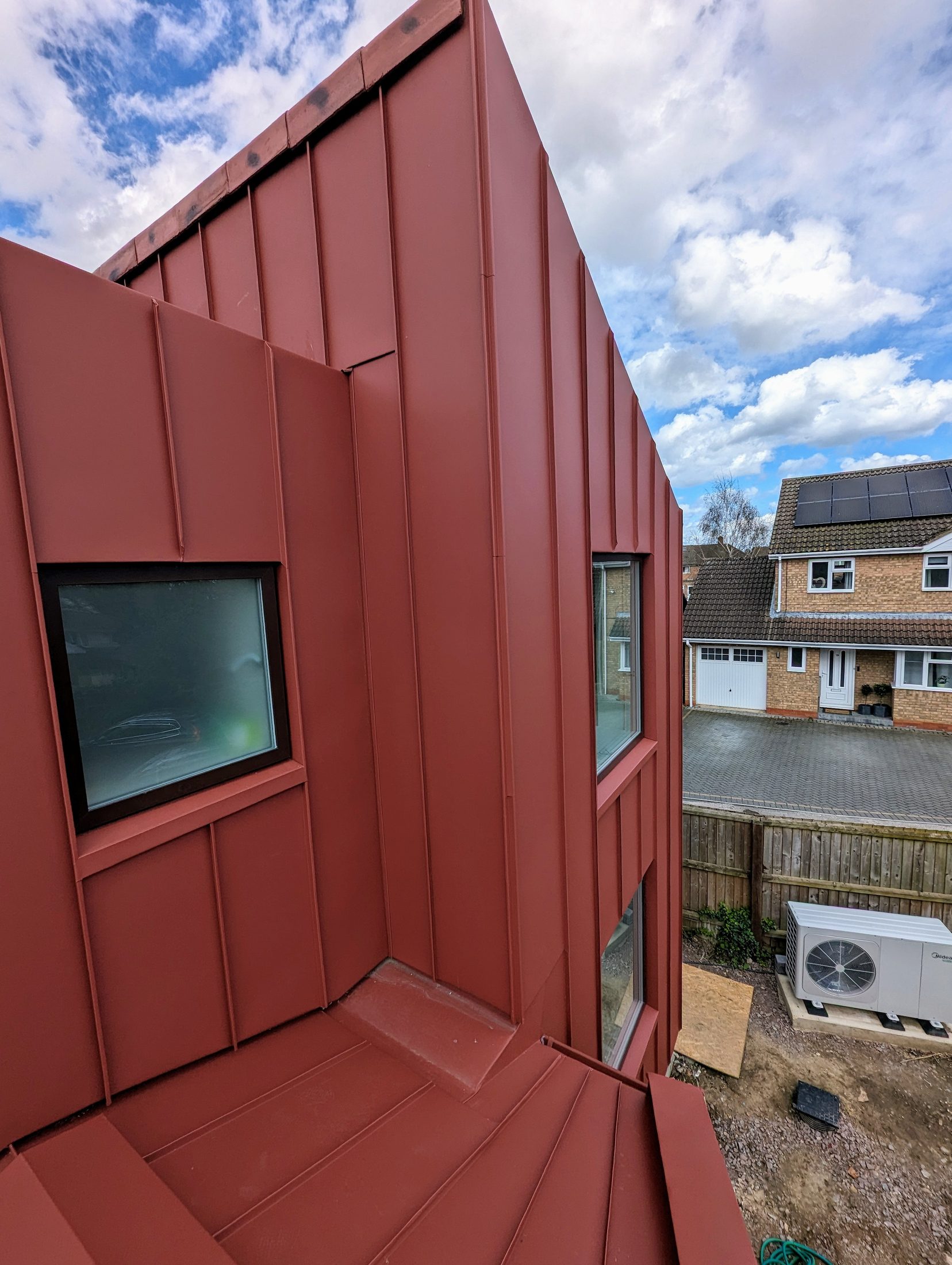 Red PREFA extension project photograph 8