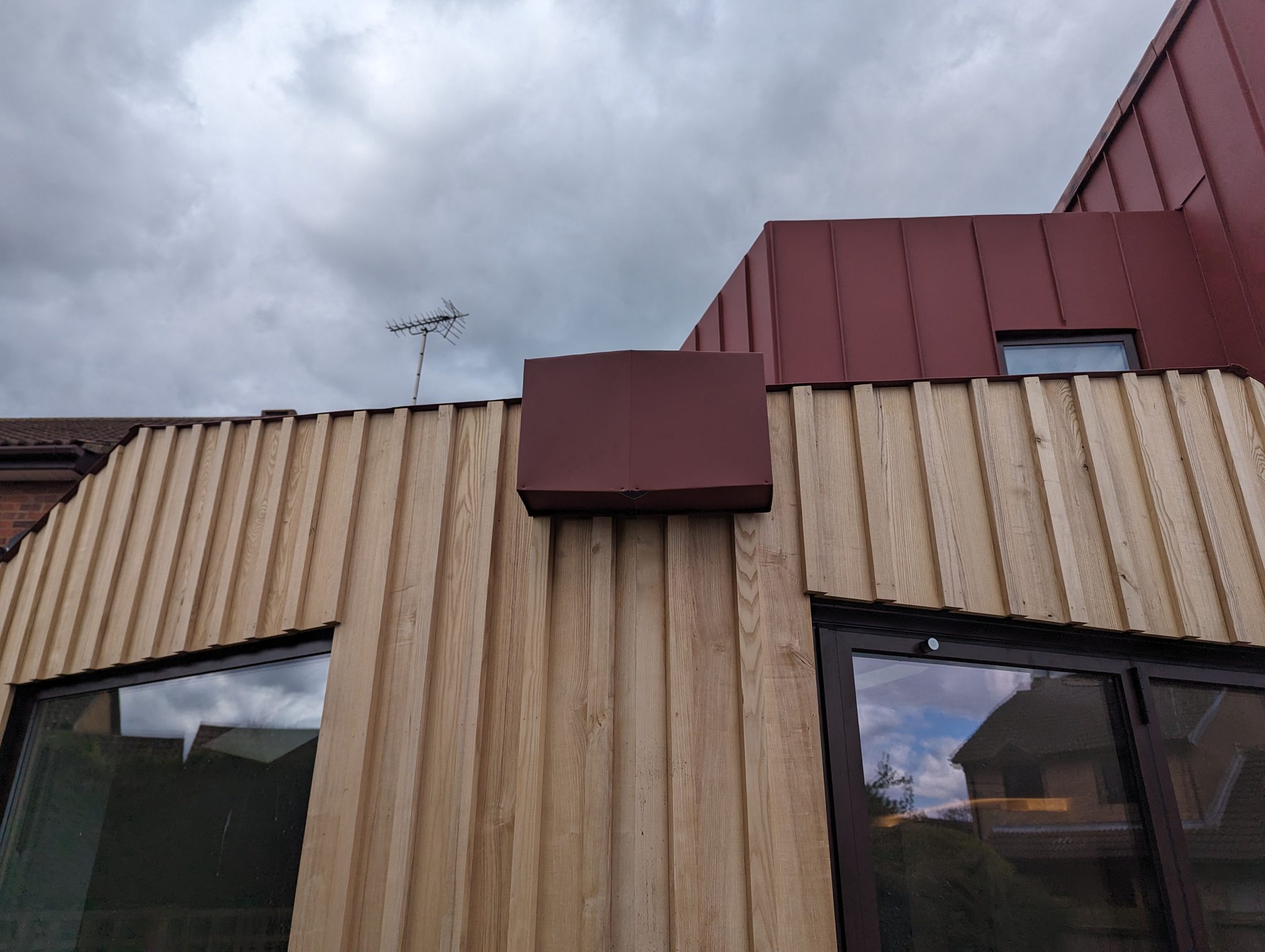 Red PREFA extension project photograph 11