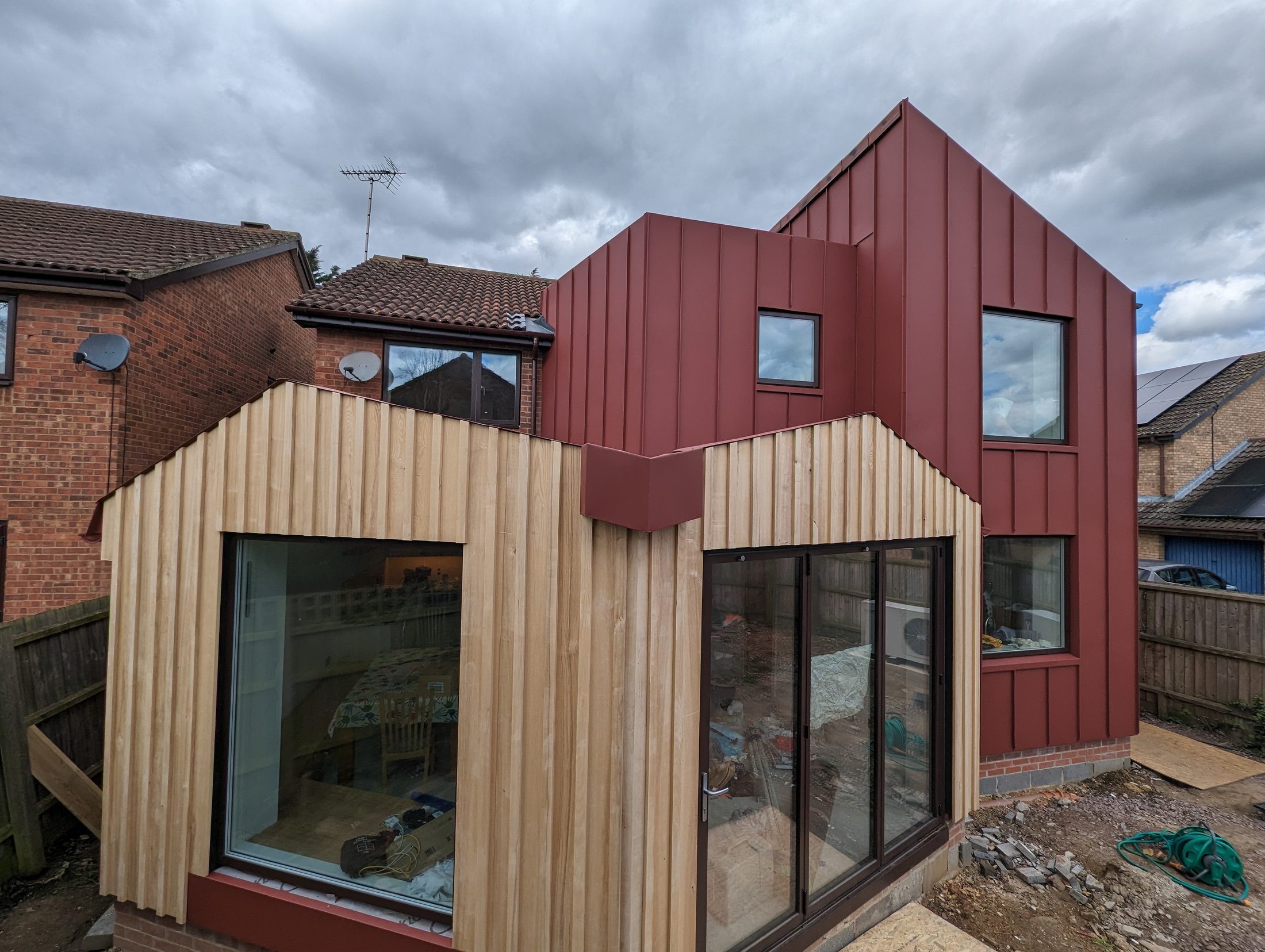 Red PREFA extension project photograph 12