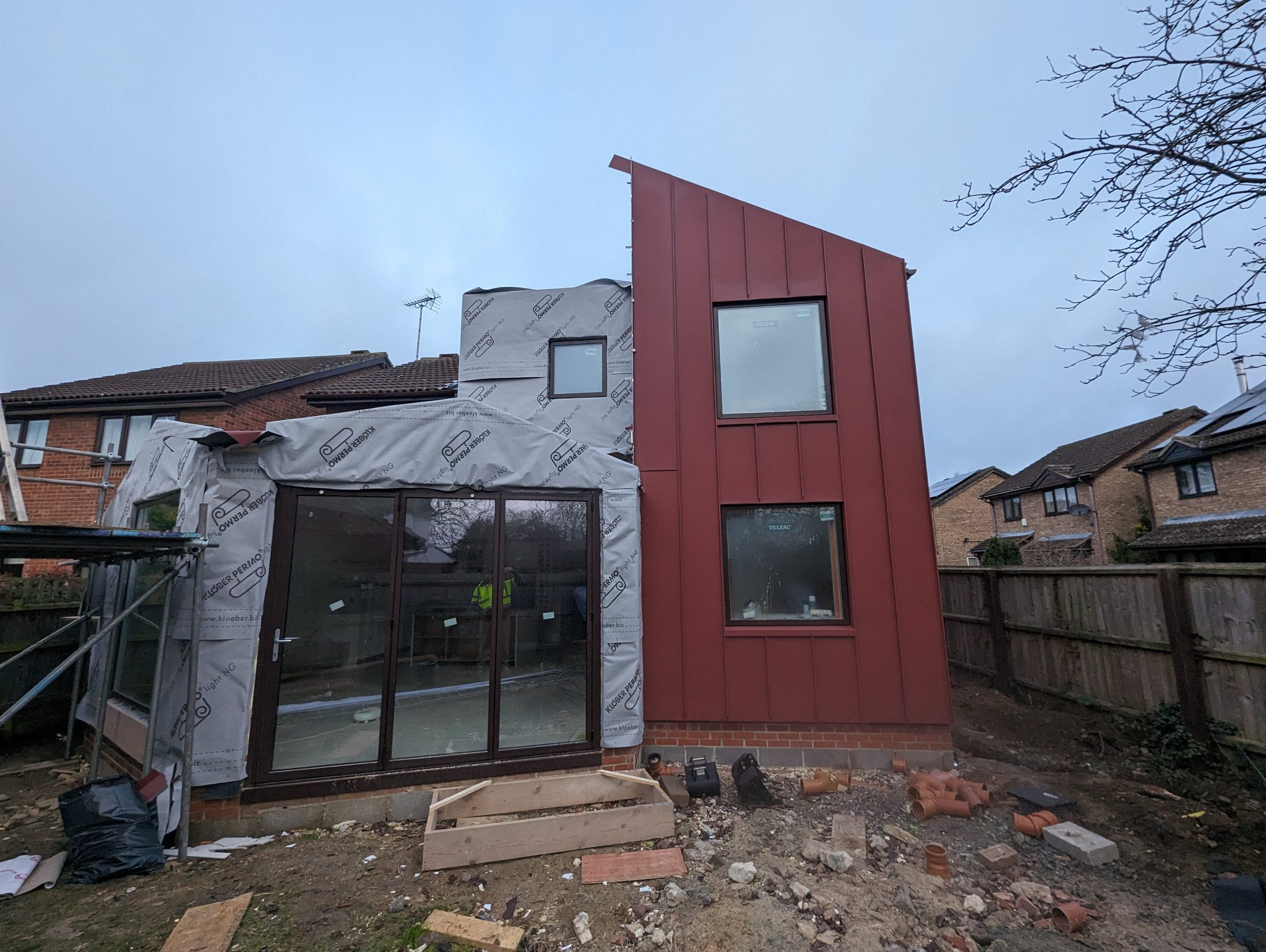 Red PREFA extension project photograph 1